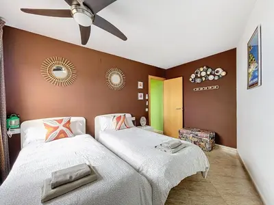 Cama o camas de una habitación en LETS HOLIDAYS Sea views apartment pool in Sa Gabarra