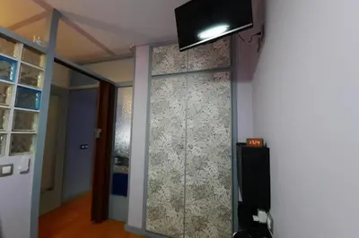 Una televisión o centro de entretenimiento en Lets Holidays POOL TERRACE APARTMENT TOSSA DE MAR
