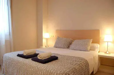 Cama o camas de una habitación en Apartamentos TDM