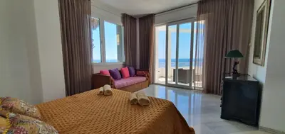 Cama o camas de una habitación en Al lado del mar 