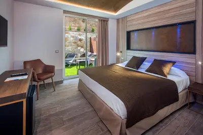 Cama o camas de una habitación en Hotel GHT Neptuno-Tossa & Venus SPA