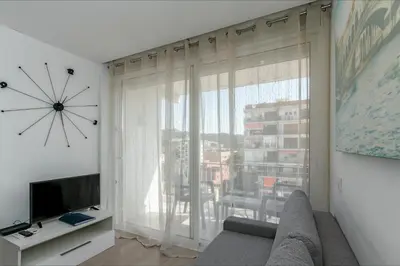 Una televisión o centro de entretenimiento en Apartamento Seven Seas