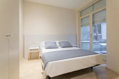 Cama o camas de una habitación en Bravissimo Cort Reial-1B