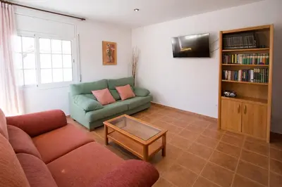Una televisión o centro de entretenimiento en Catalunya Casas Tranquil Costa Brava Retreat with private suite!