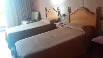 Cama o camas de una habitación en Hostal Bonaterra