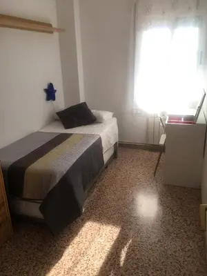Cama o camas de una habitación en The Hollidays Apartment