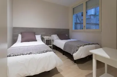Cama o camas de una habitación en Bravissimo Cort Reial-3A
