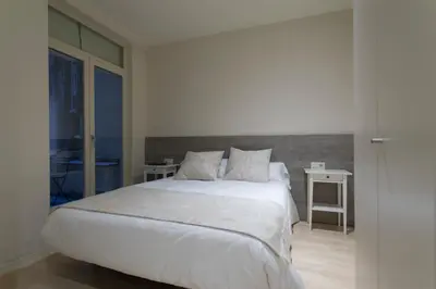 Cama o camas de una habitación en Bravissimo Cort Reial-2A