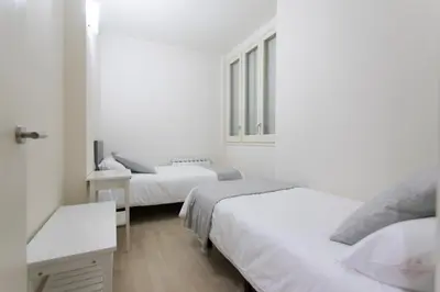 Cama o camas de una habitación en Bravissimo Cort Reial-2A