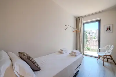 Cama o camas de una habitación en Flateli- Plaça Catalunya 2-1
