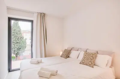Cama o camas de una habitación en Flateli - Plaça Catalunya 42