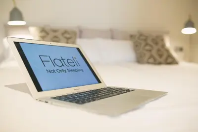 Cama o camas de una habitación en Flateli - Plaça Catalunya 42