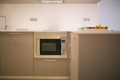 Una cocina o zona de cocina en Flateli - Exclusivo Plaça Catalunya 4-1