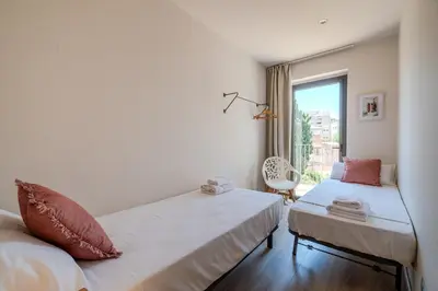 Cama o camas de una habitación en Flateli -Plaça Catalunya 3-1