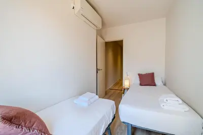 Cama o camas de una habitación en Flateli -Plaça Catalunya 3-1