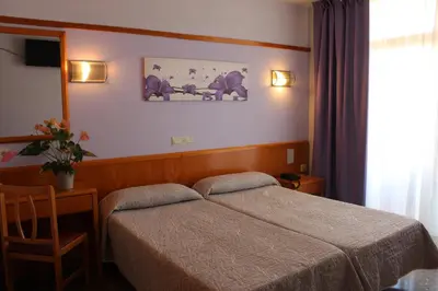 Cama o camas de una habitación en Hotel Esplendid