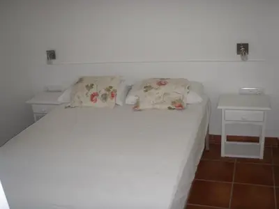 Cama o camas de una habitación en Los Pinos Apartament per 4 persones amb piscina comunitària a l'urbanització Los Pinos