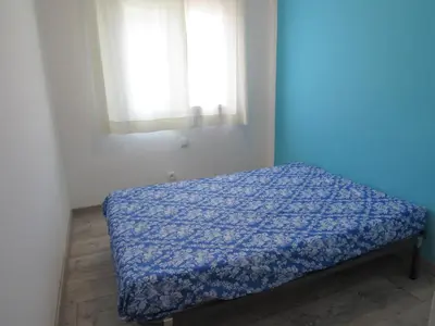 Cama o camas de una habitación en Apartament per 4 persones a Doctor Fleming a 5 minuts de la Platja Gran