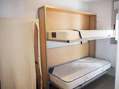 Cama o camas de una habitación en Saromar II Apartament amb dues terrasses per 6 persones a 5 minuts de la Platja Gran