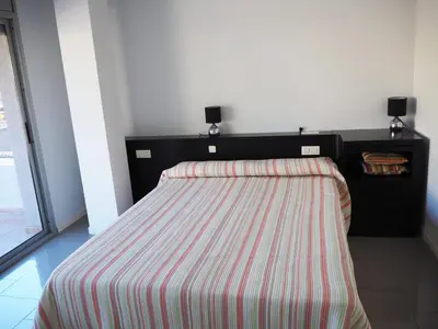 Cama o camas de una habitación en Saromar II Apartament amb dues terrasses per 6 persones a 5 minuts de la Platja Gran