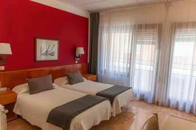 Cama o camas de una habitación en Hostal Regina