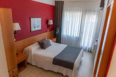 Cama o camas de una habitación en Hostal Regina