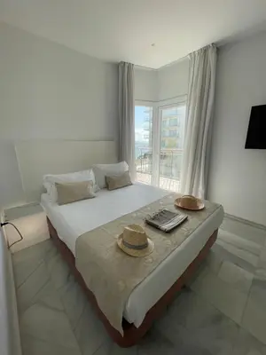 Cama o camas de una habitación en Hotel Aromar