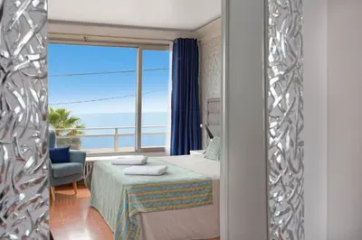 Cama o camas de una habitación en Malgrat de Mar Beachfront Village