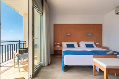 Cama o camas de una habitación en Hotel Horitzó by Pierre & Vacances
