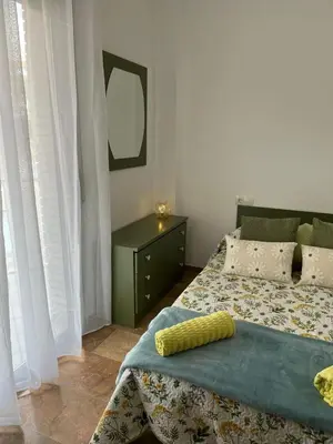 Cama o camas de una habitación en Apartamentos Jardín Turquesa
