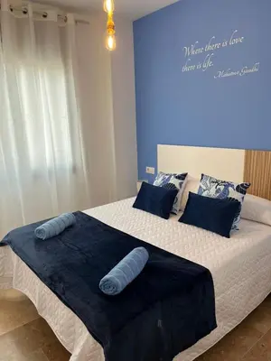 Cama o camas de una habitación en Apartamentos Jardín Turquesa