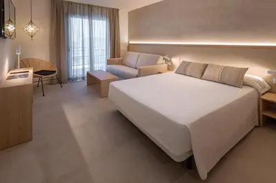 Cama o camas de una habitación en Hotel Alhambra