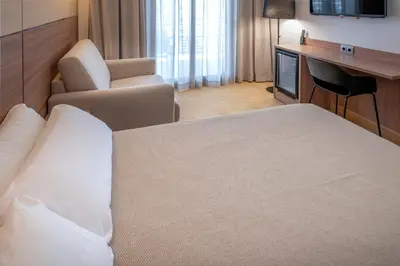 Cama o camas de una habitación en Hotel Alhambra