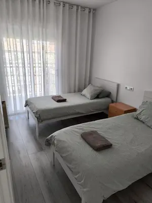 Cama o camas de una habitación en Atico Condal