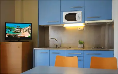 Una cocina o zona de cocina en AQUA Hotel Nostre Mar Apartments