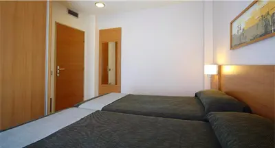 Cama o camas de una habitación en AQUA Hotel Nostre Mar Apartments
