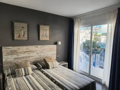Cama o camas de una habitación en Hotel Marblau Tossa