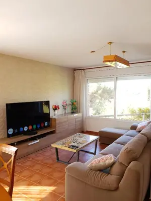 Una televisión o centro de entretenimiento en Vivalavida playa 1km