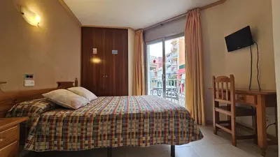 Cama o camas de una habitación en Hostal Los Maños