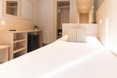 Cama o camas de una habitación en Hotel S'Agoita