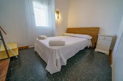 Cama o camas de una habitación en HomeHolidaysRentals Miracel - Costa Barcelona
