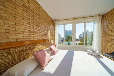 Cama o camas de una habitación en HomeHolidaysRentals Miracel - Costa Barcelona