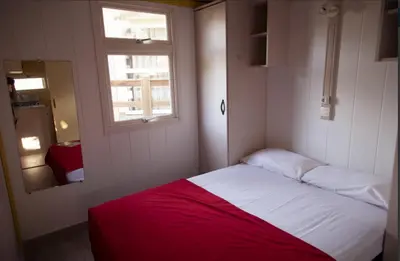 Cama o camas de una habitación en Camping Sènia Tucan