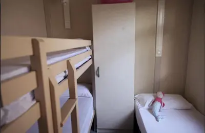 Cama o camas de una habitación en Camping Sènia Tucan