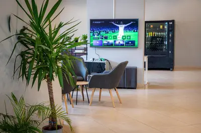 Una televisión o centro de entretenimiento en Apartamentos Comfort Calella