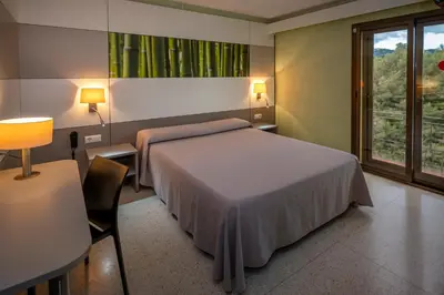 Cama o camas de una habitación en Hotel Sabiote