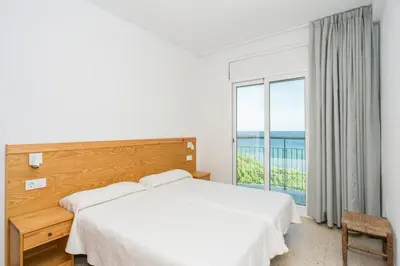 Cama o camas de una habitación en Apartamentos Blanes-Condal Costa Brava
