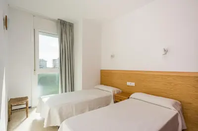 Cama o camas de una habitación en Apartamentos Blanes-Condal Costa Brava