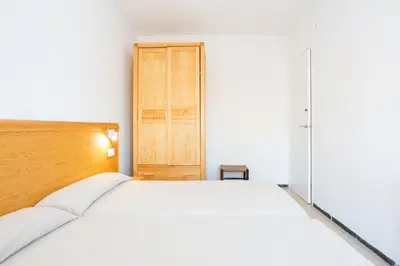 Cama o camas de una habitación en Apartamentos Blanes-Condal Costa Brava