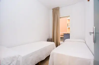 Cama o camas de una habitación en Apartamentos Blanes-Condal Costa Brava